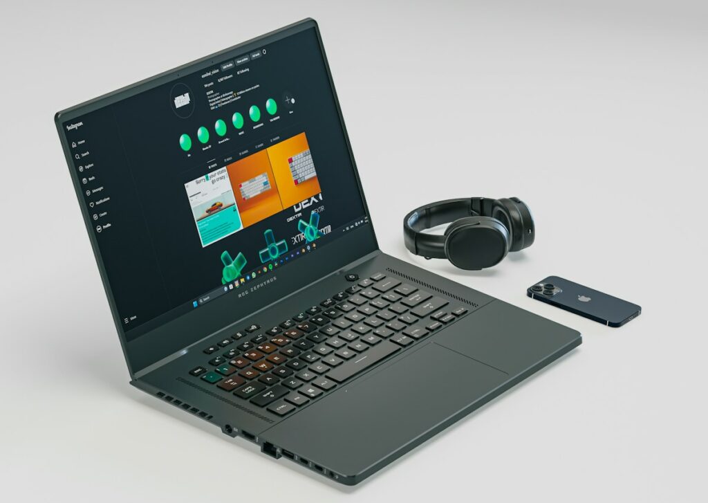 a laptop computer sitting on top of a white table